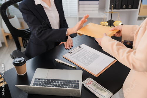 Canvastavla Bribe Refusal: A business person in a suit refuses to accept a bribe envelope, pushing it away from a document on a desk