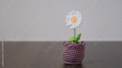 Handmade crochet daisy flower in purple pot
