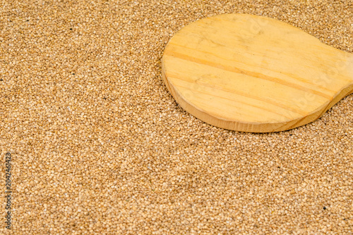 Chenopodium quinoa - Organic white quinoa seeds in bowl and spoon