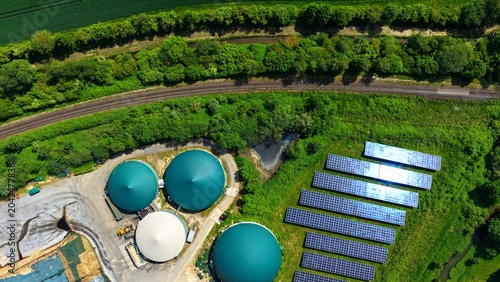 Фотография Aerial View of Solar Farm and Biogas Domes Next to Railway Germany