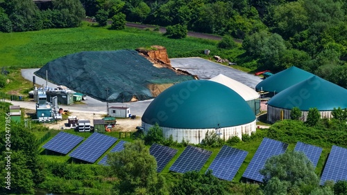 Photos Aerial View of Solar Farm and Biogas Digesters in Green Landscape Germany