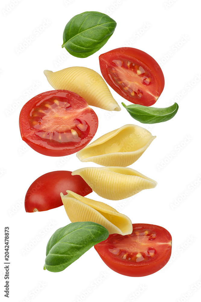 Naklejka premium Falling pasta with tomato and basil isolated composition