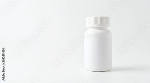 White medicine bottle on plain background