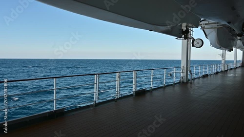 View of a ship deck featuring lifeboats clearly positioned along the structure
