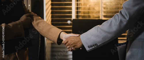 business partner handshake concept Colleagues shaking hands Successful deal after a great meeting. Blurred background.