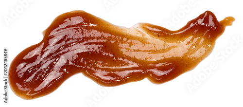 Textured smear of dark red barbecue sauce in wave shape
