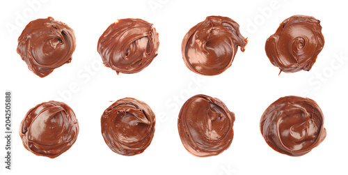 Photos Set of eight round swirls of chocolate cream isolated on white
