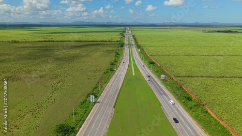 Aerial View of Modern Highway Surrounded by Greenery at Sunset