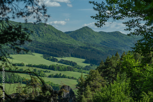 Green fresh spring landscape blue sky hot day Strazovske mountains and Sulov