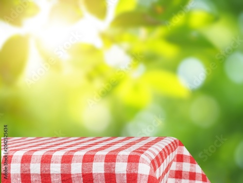 Fabric tablecloth on wooden table on blur background
