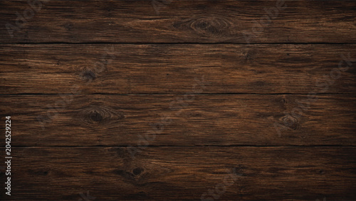 Photos A natural dark wood texture featuring an old brown timber grain pattern on a wea