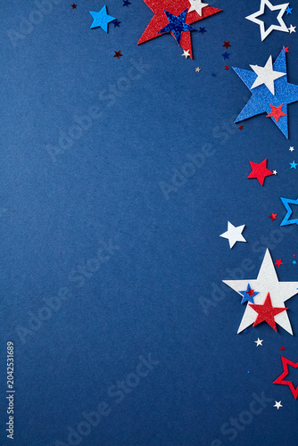 Vertical composition with red, white, and blue stars forming a border on the right side against a navy blue background. Patriotic design with copy space for USA holidays.