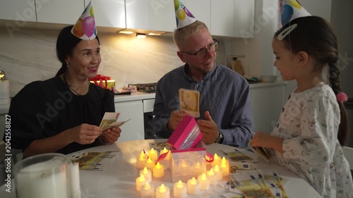 Family Birthday Party Candles Games Home: Celebrating child's birthday with games and candles at home.