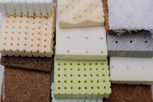 Bilde på lerret Close-up of stacked mattress material samples, including firm coconut coir layers and soft latex foam