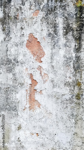 A close-up view of a distressed concrete wall with peeling paint and visible textures. AI.