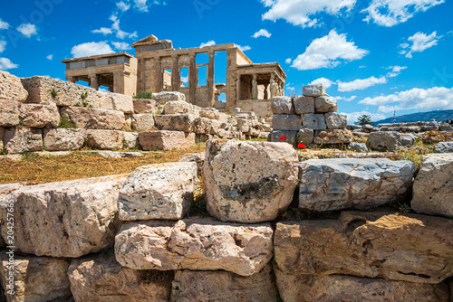 Obraz na plátne Fallen stones on the Acropolis of Athens with The Erechtheion in background, cultural and architectural landmarks of ancient Greece