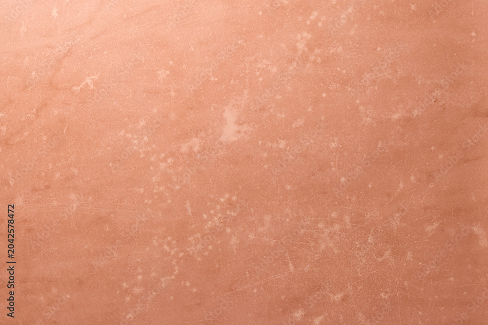 Fototapeta premium Coral Pink Printed Texture Background with Copy Space. Top View