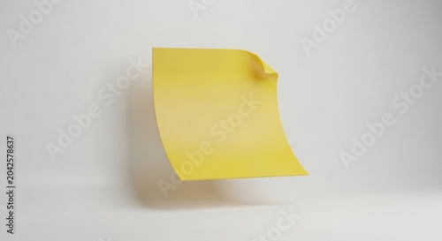 Floating yellow sticky note on white background with curled edge and copy space