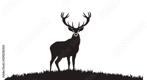 Cuadro en lienzo Majestic Stag Silhouette Stands Proudly on Grassy Knoll.