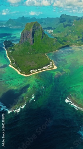 Aerial view of Le Morne Peninsula, Le Morne Brabant Mountain. Sea lagoon formed by coral reefs, Mauritius Island, Africa, Indian Ocean. Underwater waterfall in Le Morne