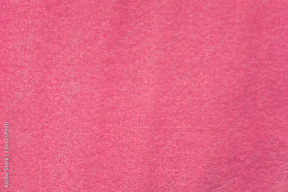 Fototapeta premium Pink textured background with soft fabric-like surface symbolizing creativity, femininity, modern design, elegant aesthetics, and decorative backdrop