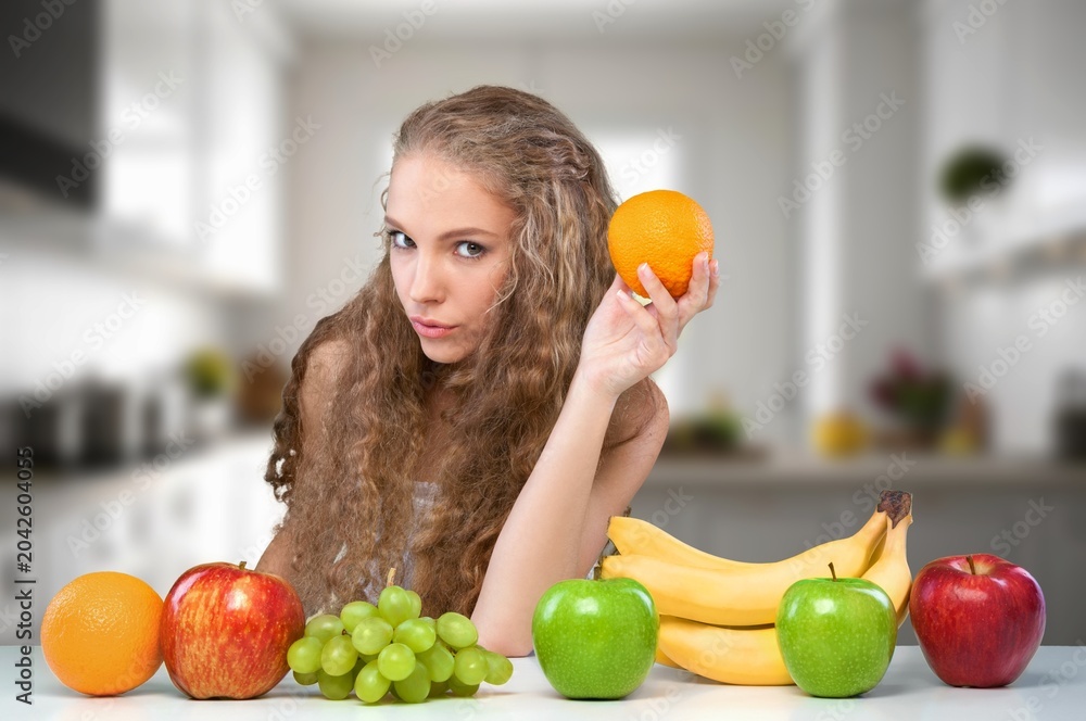 Fototapeta premium Healthy eating concept. Beautiful woman with fruits