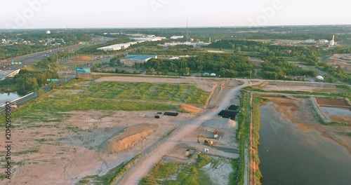 20 September 2025 Sayreville NJ Construction site near highway, river area has land being cleared prepared for new buildings are vehicles and equipment scattered around.