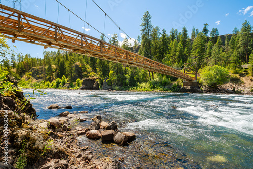 The wooden suspension bridge over the Spokane River at the Bowl and Pitcher area of Riverside State Park in Spokane, Washington, USA