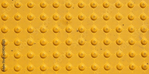 Tableau sur toile Yellow tactile paving texture for visually impaired safety