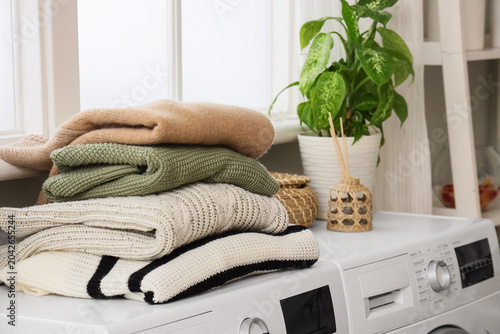 Stack of knitted sweaters o...