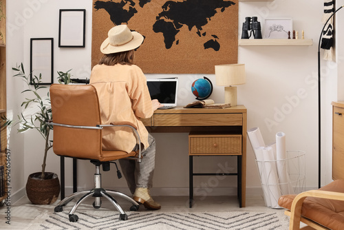 Female traveler working wit...