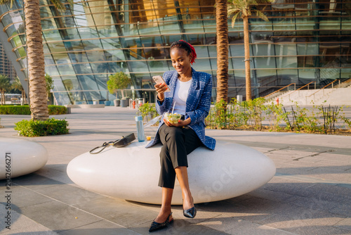 A woman eating lunch outdoors