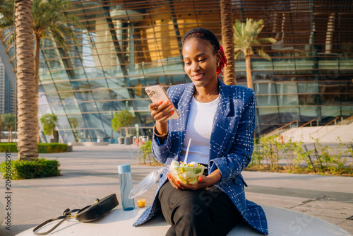 A woman eating lunch outdoors