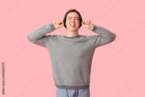 Young man in hat showing hi...
