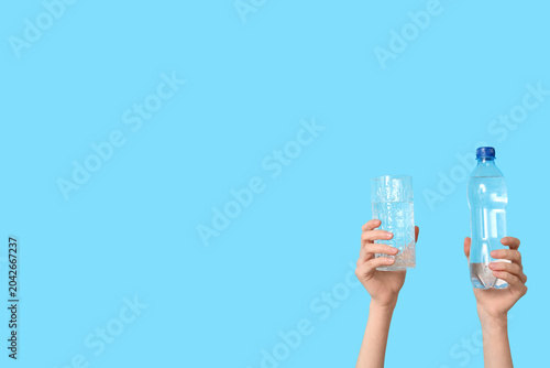 Female hands with glass and...