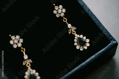 close up of golden studded earrings 
