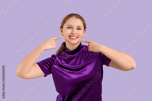Young redhead woman pointin...