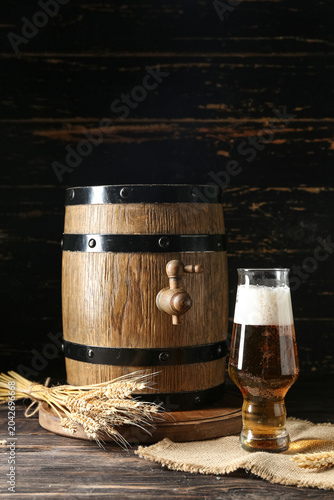 Oak barrel and glass of col...