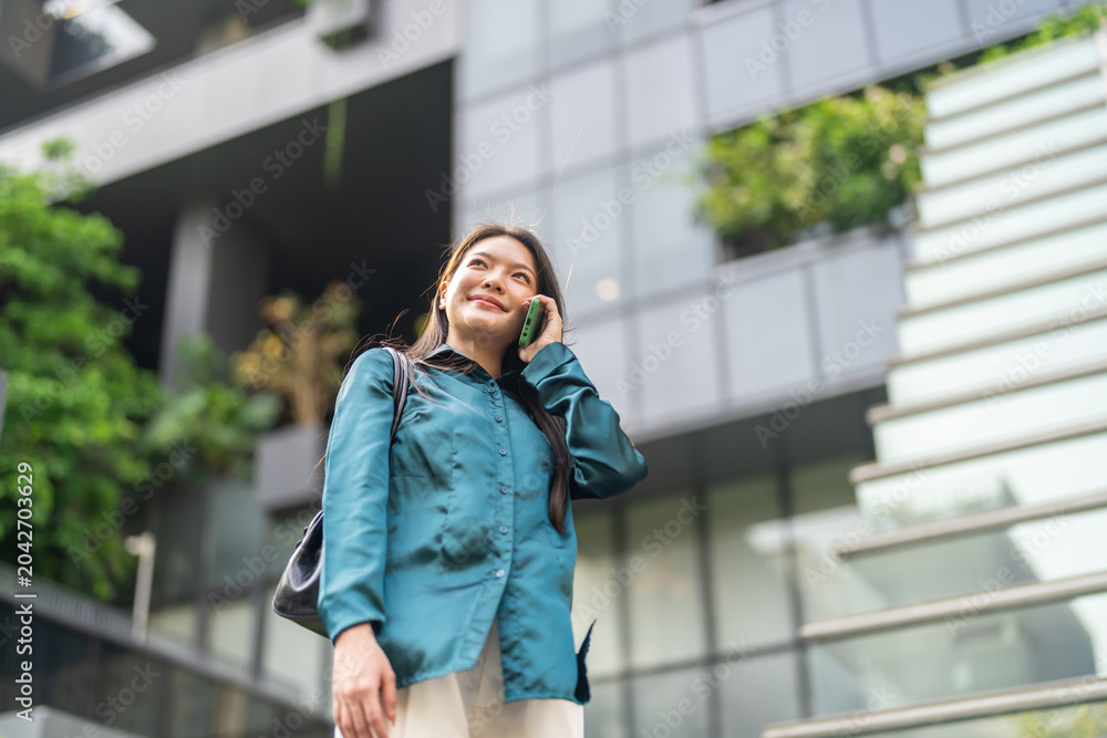 Fototapeta premium Asian woman talking on smartphone calling customer service, Female user contacting helpdesk support to solve problem, Telecommunication, call center, mobile phone network and remote assistance concept