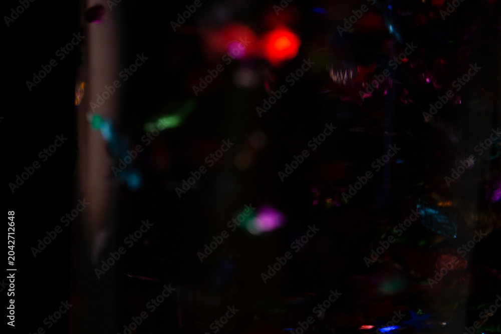 Fototapeta premium Abstract Dark Background with Colorful Bokeh Lights and Shimmering Particles