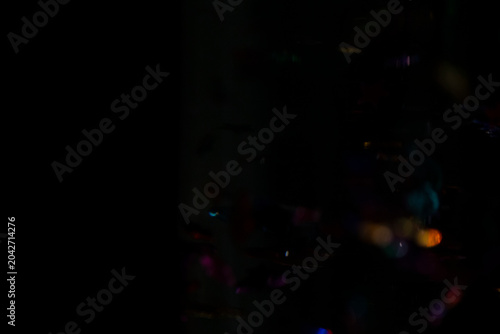 Billede på lærred Abstract Colorful Bokeh Light Streaks on Dark Background Overlay