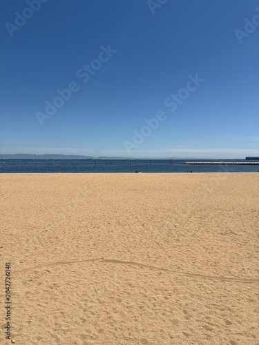 Peaceful Empty Beach with Blue Sky and Sea