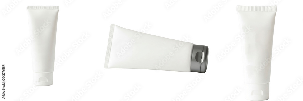 Fototapeta premium A Set of blank cosmetic tube PNG mockups, three white plastic lotion or cream containers isolated on transparent background for branding, packaging design and skincare ads