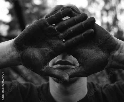 Person With Dirty Hands Covers Face Moody Portrait