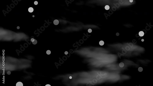 White circular light particles drift in a dark gray cloudy night sky. Perfect for backgrounds, overlays, or mystical design projects.