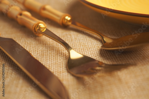 Принти на полотні Elegant gold utensils on a table setting for dining occasion