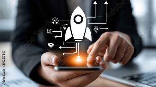A person interacts with a smartphone displaying a digital rocket icon symbolizing business growth, innovation, and startup success.