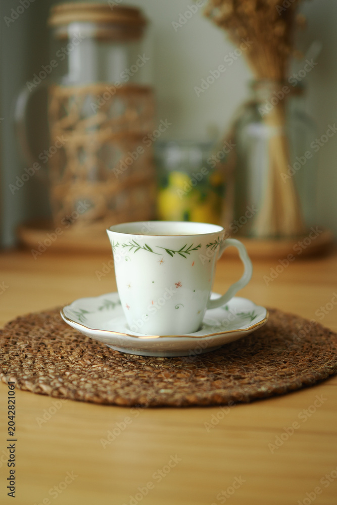 Fototapeta premium Tea cup on a table with a light background
