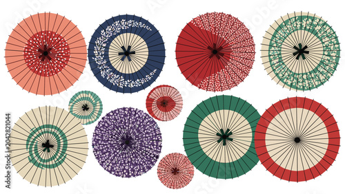 Overhead view of several traditional Japanese wagasa paper umbrellas displays beautiful intricate patterns and vibrant artistic colors.