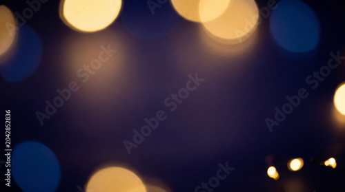 Abstract golden and blue bokeh light background with copy space